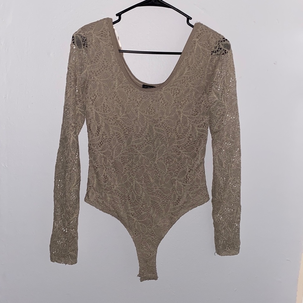 Nude lace body suit. Never worn.